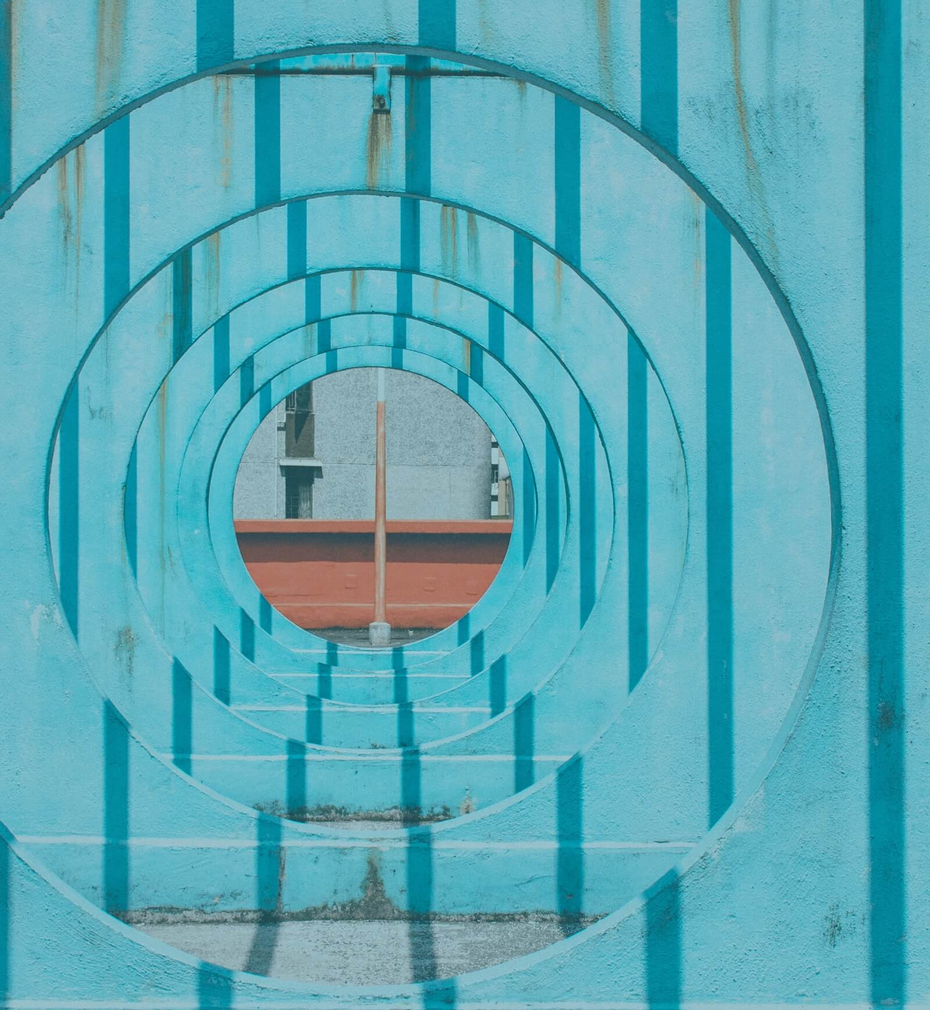 Abstract view of blue walls with circule holes in them